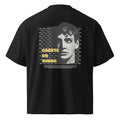 Espalda de camiseta oversize negra con mensaje Cógete un buche — MúkaroPR streetwear boricua
